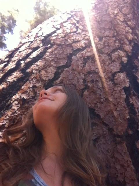 Olivia photographed beside a tree, from the 2014 Standstill post