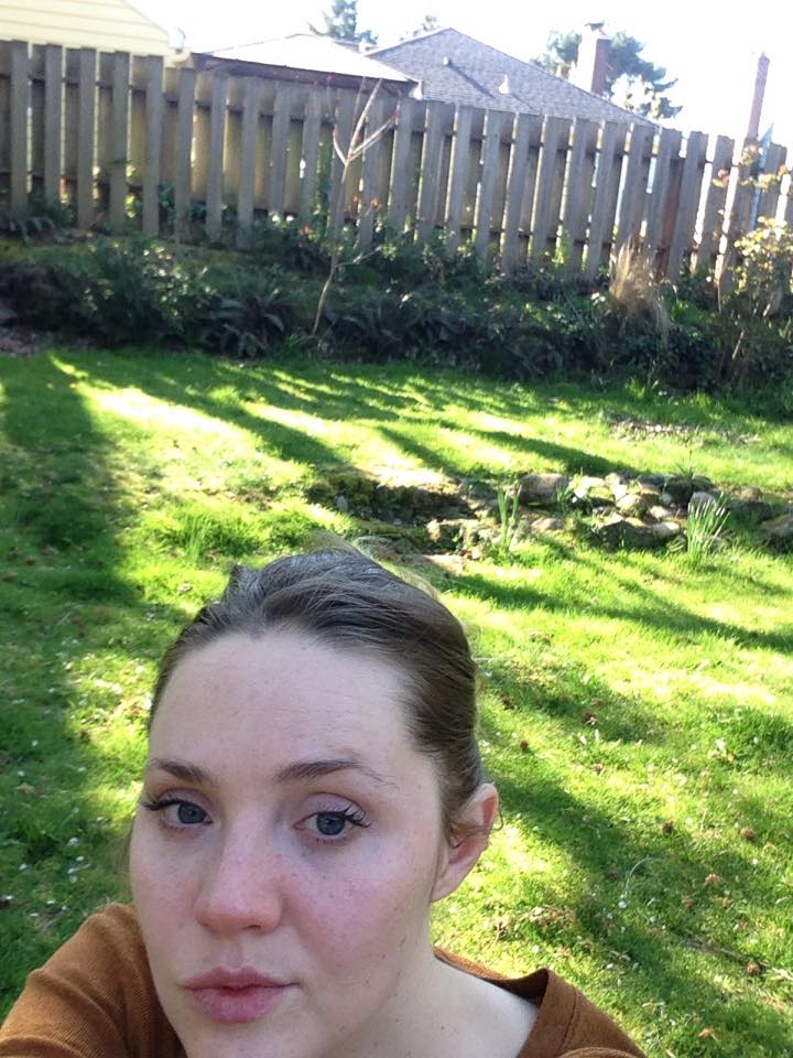 Olivia selfie outdoors in a yard, from a 2021 post