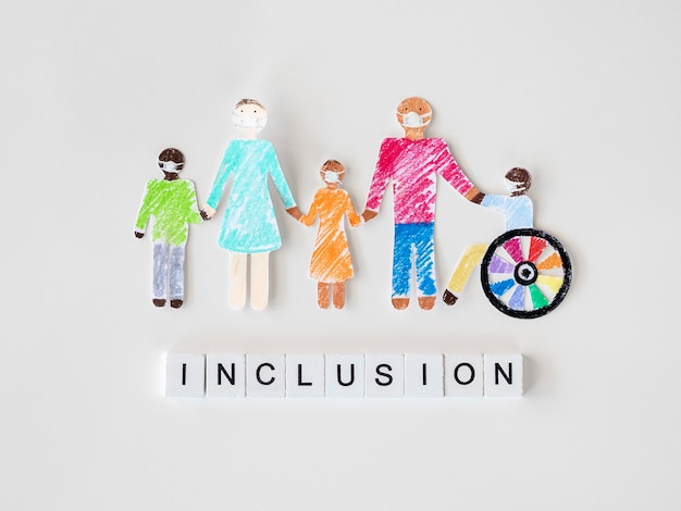 family with disables person in cutout paper inclusion concept